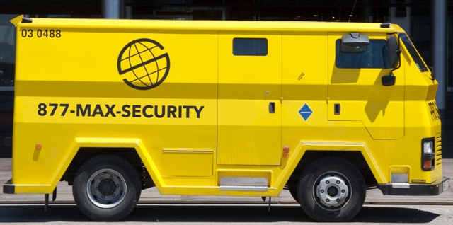 Yellow security vehicle using 1-877-MAX-SECURITY