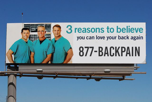 3 doctors on billboard using 1-877-BACKPAIN