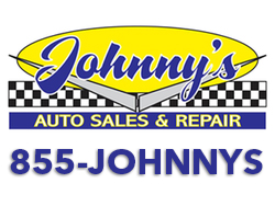 Johnny's Auto Sales sign using 1-855-JOHNNYS