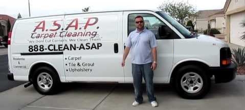 Man standing in front of an ASAP Carpet Cleaning van using 1-888-CLEAN-ASAP